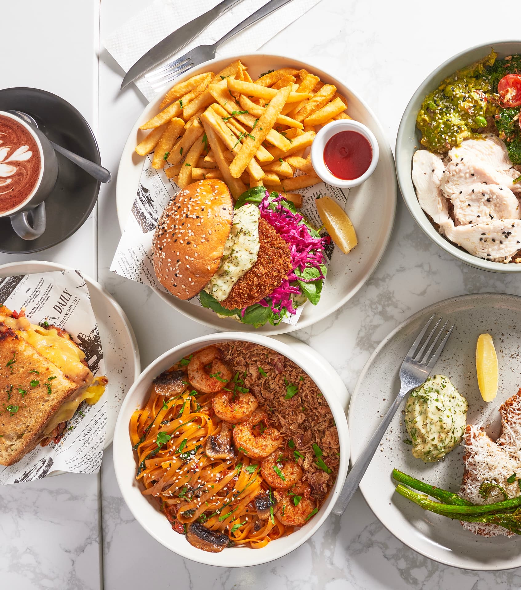 A spread of Boom Cafe dishes on a marble table